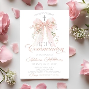 May include: A Holy Communion invitation card with a pink bow and floral accents. The card includes the text "Holy Communion" and event details. Pink roses and petals surround the card on a white background.
