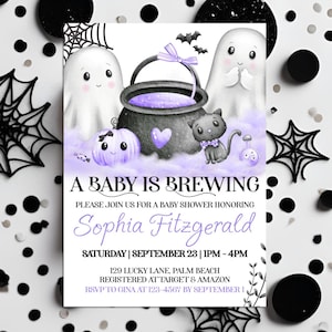 May include: A baby shower invitation with a Halloween theme. The invitation features a cauldron with purple potion, ghosts, a black cat, and a pumpkin. Text reads "A Baby is Brewing" and details for Sophia Fitzgerald's baby shower.