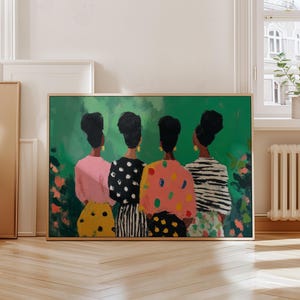 May include: A framed art print featuring four figures viewed from the back, each wearing a different patterned top and skirt. The color palette includes pink, black, white, yellow, and green, with gold earrings. The background is a vibrant green with floral accents.