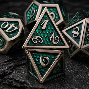 May include: A set of polyhedral dice featuring a metallic silver frame and a deep green, scale-textured inlay. The dice display engraved numbers in a stylised font, with one triangular die stacked directly on top of a four-sided die.