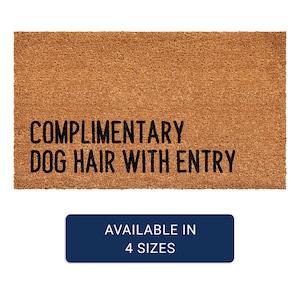May include: A rectangular doormat made of brown coir fiber. The text "COMPLIMENTARY DOG HAIR WITH ENTRY" is printed in black. A blue rectangle at the bottom reads "AVAILABLE IN 4 SIZES".