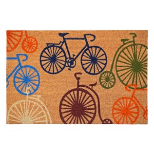 May include: A rectangular doormat with a natural coir fiber background. The mat features a repeating pattern of bicycles in various colors, including blue, green, orange, and brown. The bicycles are stylized and add a decorative touch.