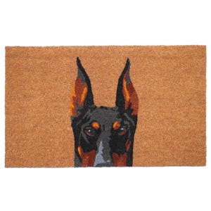 May include: A rectangular doormat featuring a detailed illustration of a Doberman Pinscher's head. The dog's face is black with brown and orange accents on the ears. The background is a natural brown color, providing a welcoming entrance.