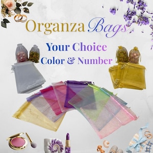 May include: Organza bags in various colors, with the text "Your Choice Color & Number." The image displays several bags in shades of gold, pink, purple, and silver. Some bags are filled with small items. Accessories like makeup and jewelry are also shown.