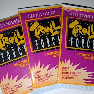 May include: Three unopened Troll Force collectible card packs. Each pack is purple with yellow and black text and graphics. The packs read "Star Pics Presents" and "7 Collectible Cards Plus 1 Sticker."