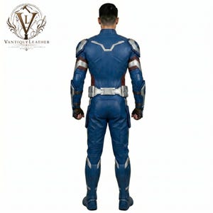 May include: A blue leather full-body suit featuring silver armor plating on the shoulders, forearms, and waist. The suit includes dark brown gloves and intricate paneling throughout the back, legs, and arms, with the VANTIQUELEATHER logo visible.
