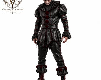 May include: A black leather clown costume featuring a high ruffled collar, long sleeves with ruffled cuffs, and a peplum waist. The outfit includes three dark red pom-poms down the front and matching red pom-poms on the ruffled pant cuffs.