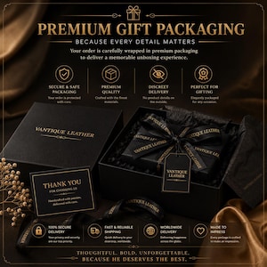 May include: A black gift box with the Vantique Leather logo, tied with a black ribbon featuring the brand name. Includes a matching thank you card, black tissue paper, and a branded tag, all presented with gold text detailing premium packaging.