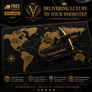 May include: A black and gold world map graphic featuring a miniature black airplane model with gold accents. A black tag with the gold text VantiqueLeather is attached to the plane. The map includes text labels for continents and a compass rose.