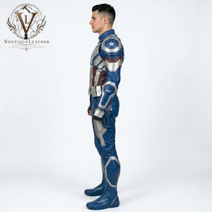 May include: A blue, silver, and dark red leather costume featuring a star emblem on the shoulder, a structured jacket, matching trousers, and boots. The outfit includes a utility belt and molded armor plating on the arms and legs, presented in a side profile view.