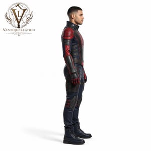 May include: A full-body leather costume featuring a dark navy blue and red color scheme with a high collar, structured shoulder panels, integrated gloves, and reinforced knee pads. The suit displays a spider emblem on the chest and black boots.