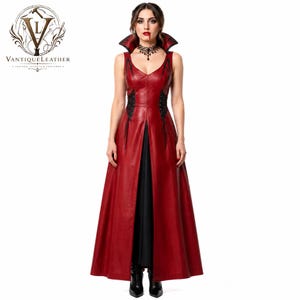 May include: A sleeveless floor-length dress in deep red leather featuring a high standing collar, a deep V-neckline, and black lace-up side panels. The garment has a central front slit revealing a black underskirt and a fitted bodice design.