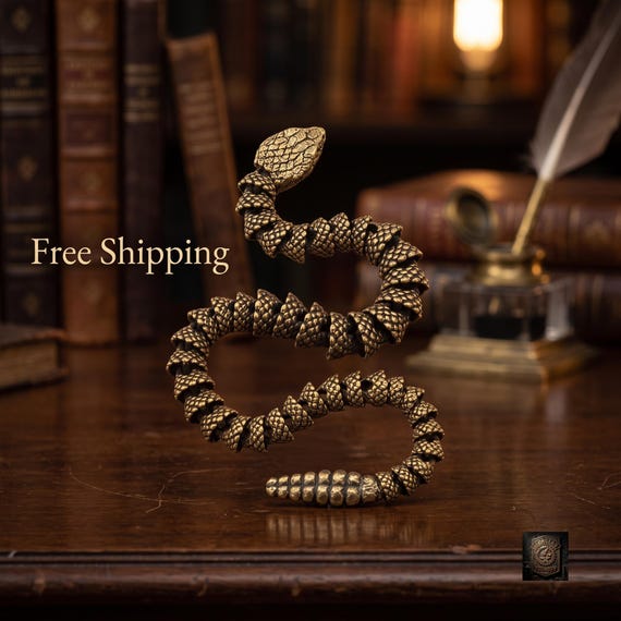 Each segment of this fully articulated brass snake is individually crafted and linked so it slithers realistically in your hand — kinetic desk sculpture meets satisfying fidget object.
