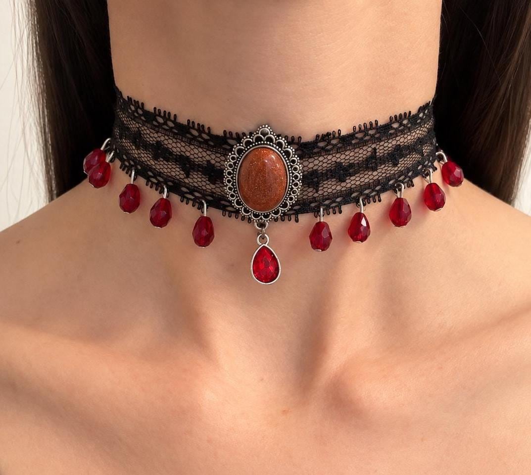 Wide black floral lace choker with faceted blood red crystal drops