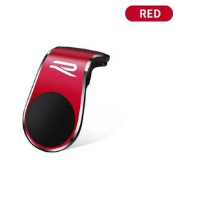 以下が含まれることがあります： 黒い円形の磁気領域を備えた赤い車の電話マウント。マウントはシルバーのトリムと様式化された白いロゴが付いています。「RED」という単語が赤い楕円形で表示されています。