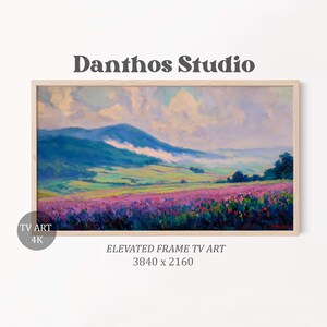 Puede incluir: Pintura de paisaje enmarcada con un campo de flores moradas, colinas verdes y una cordillera azul bajo un cielo nublado. El texto "Danthos Studio" está en la parte superior.
