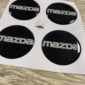 Hjulkapseldekaler Mazda - Epoxihartsdekaler (4 st, 20-130 mm), Bränsletankemblem/Alla storlekar