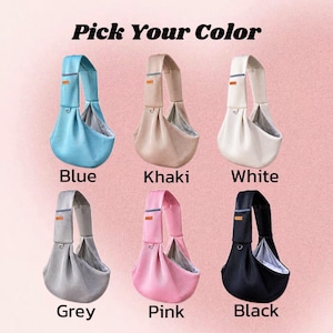 Puede incluir: Seis portabeb&eacute;s de tipo bandolera dispuestos en dos filas, con el texto Pick Your Color. Los colores son azul, caqui, blanco, gris, rosa y negro. Cada portabeb&eacute;s cuenta con una correa ancha, una bolsa profunda, una etiqueta y una anilla.
