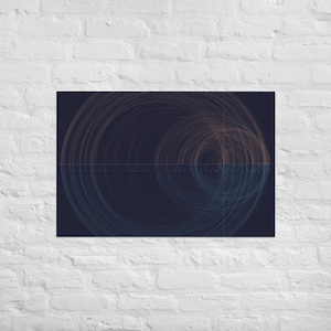 May include: Abstract art print with concentric circles in orange and teal hues set against a dark blue backdrop. The artwork is displayed on a white brick wall, providing a strong visual contrast.