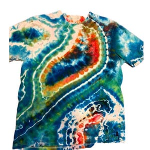May include: A tie-dye t-shirt with a vibrant swirl pattern in shades of blue, green, orange, and white. The shirt has a crew neck and short sleeves. The fabric appears to be cotton.