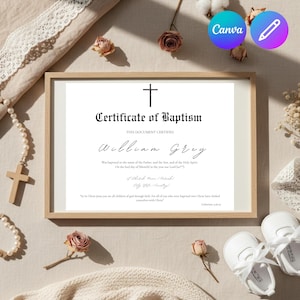 Op de afbeelding: Een ingelijste doopakte met een kruis en de naam William Grey. De afbeelding bevat babyschoentjes, een rozenkrans en gedroogde bloemen, wat wijst op een religieus of herdenkingsthema.