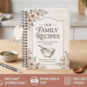 Peut inclure: Un carnet de recettes à reliure spirale intitulé Our Family Recipes avec 200 pages. La couverture présente des illustrations florales brunes, un bol mélangeur avec un fouet, et le texte A 200-Page Recipe Journal & Keepsake et Blank Pages to Fill In with Your Cherished Dishes.