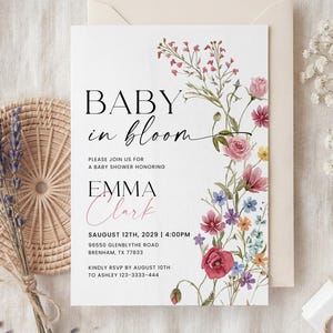 Collection of matching baby shower stationery designs including an invitation, diaper raffle ticket, books for baby card, and thank you note, all featuring a watercolor wildflower theme.