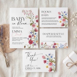 Collection of matching baby shower stationery designs including an invitation, diaper raffle ticket, books for baby card, and thank you note, all featuring a watercolor wildflower theme.