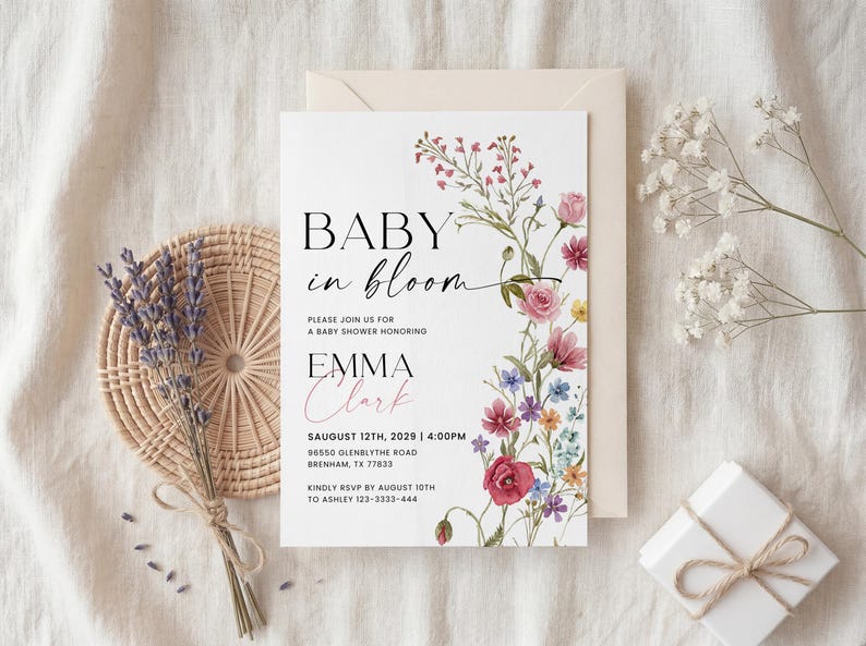 Collection of matching baby shower stationery designs including an invitation, diaper raffle ticket, books for baby card, and thank you note, all featuring a watercolor wildflower theme.