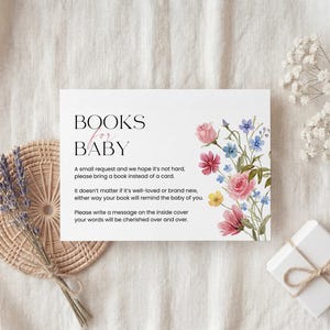 Collection of matching baby shower stationery designs including an invitation, diaper raffle ticket, books for baby card, and thank you note, all featuring a watercolor wildflower theme.