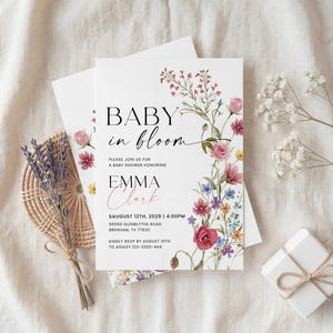 Collection of matching baby shower stationery designs including an invitation, diaper raffle ticket, books for baby card, and thank you note, all featuring a watercolor wildflower theme.