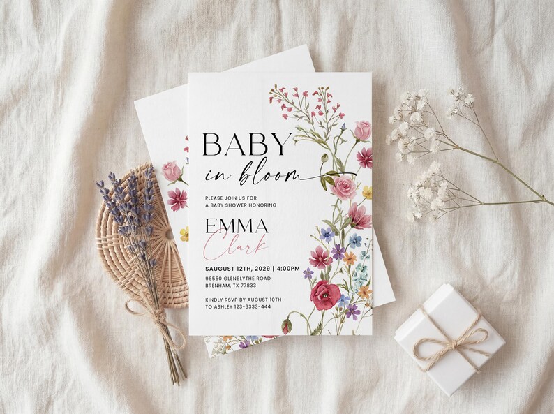 Collection of matching baby shower stationery designs including an invitation, diaper raffle ticket, books for baby card, and thank you note, all featuring a watercolor wildflower theme.