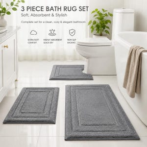Puede incluir: Un juego de tres alfombras de baño en gris sólido, que incluye una alfombra rectangular, una más pequeña y una alfombra de contorno con recorte. El texto dice: 3 PIECE BATH RUG SET, Soft, Absorbent & Stylish, ULTRA SOFT COMFORT, HIGHLY ABSORBENT QUICK DRY, NON SLIP BACKING.