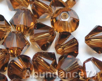 Perles toupies en cristal Swarovski 5328 TOPAZE FUMÉ sélectionner la quantité - Disponible en 3 mm, 4 mm, 5 mm, 6 mm et 8 mm