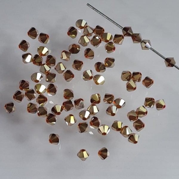 Swarovski Crystal Bicone Beads 5328 5301 Xillion Color : Crystal Metallic Sunshine 2X , select quantity - Available in 4mm