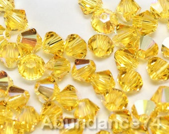 Swarovski Crystal Bicone Beads 5328 5301 LIGHT TOPAZ AB - Available in 3mm, 4mm, 5mm and 6mm ( select quantity and sizes )