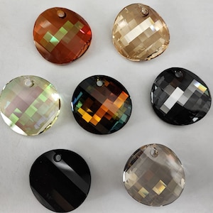 May include: Assortment of eight round crystal pendants with a faceted design. The pendants are in various colors, including black, brown, gold, and clear.