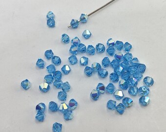 スワロフスキー（3/4 mm）アクアマリンAB 2X FCバイコーンビーズ