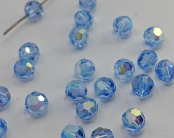 Cuentas redondas de cristal Swarovski 5000, color ZAFIRO CLARO AB. Seleccione la cantidad: disponibles en 4 mm, 6 mm y 8 mm.