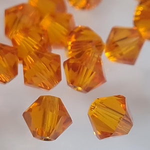 Swarovski Crystal Bicone Beads 5328 5301 Xillion Color : Tangerine , select quantity - Available in 3mm, 4mm, 5mm and 6mm
