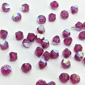 Kryształowe koraliki Swarovski Bicone 5328 5301 FUCHSIA AB - dostępne w rozmiarach 3 mm, 4 mm i 5 mm (wybierz ilość i rozmiary)