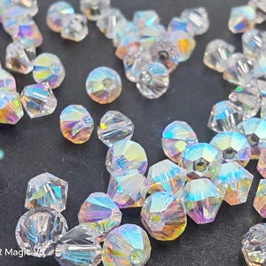 Swarovski Elements Kristallen Xilion kralen 5328 3 mm, 4 mm, 5 mm, 6 mm en 8 mm Kristalhelder AB2X (Aurora Borealis 2X) Kies hoeveelheid en maat