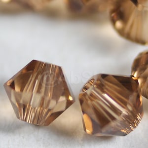 Swarovski Crystal Beads BICONE 5328 5301 Light Smoked Topaz- Available in 3mm, 4mm, 5mm and 6mm