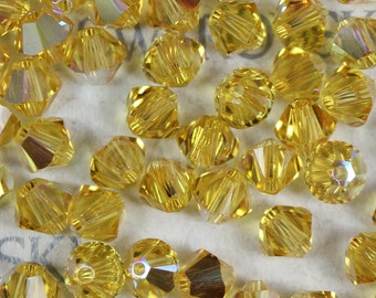 Swarovski Crystal Bicone Beads 5328 5301 LIGHT TOPAZ AB - Available in 3mm, 4mm, 5mm and 6mm ( select quantity and sizes )