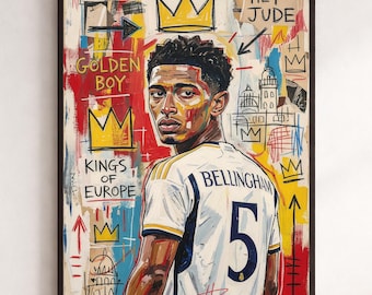 May include: A framed mixed-media style art print featuring a portrait of a soccer player wearing a white jersey with the number 5 and the name BELLINGHAM. The background includes graffiti-style text like HEY JUDE, GOLDEN BOY, and KINGS OF EUROPE.
