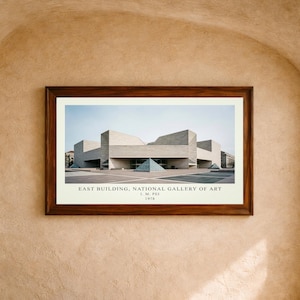 May include: A framed architectural print of the East Building of the National Gallery of Art, featuring geometric stone structures and a glass pyramid. The text below reads: EAST BUILDING, NATIONAL GALLERY OF ART, I. M. PEI, 1978.