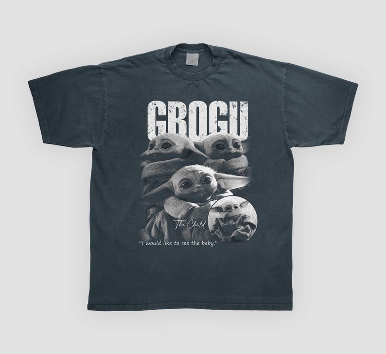 May include: Dark gray t-shirt featuring a graphic of Grogu, also known as The Child, from The Mandalorian. The design includes multiple images of Grogu with the word "GROGU" above and the text "I would like to see the baby." below.