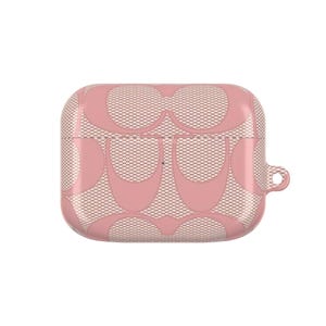 May include: Pink protective case for wireless earbuds. The case features a repeating pattern of interlocking shapes over a mesh background. A small loop is on the side for attaching to a keychain or lanyard.