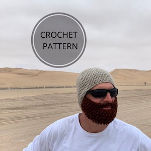 May include: A person wearing a crocheted hat and beard with sunglasses. The hat is light gray, and the beard is dark brown. The image includes a circular graphic with the words "CROCHET PATTERN".