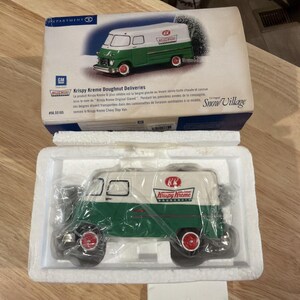 May include: A Krispy Kreme Doughnut Deliveries Chevy Step Van collectible. The van is white and green with red wheels and the Krispy Kreme logo. The van is in its original packaging, which includes a picture of the van and text.